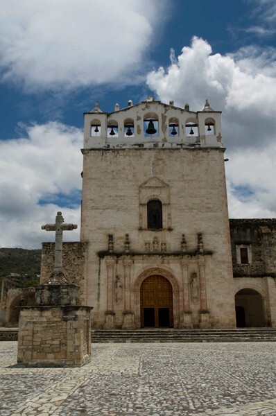 Façade & atrial cross - Façade, exterior buttressing, lateral portal, open & posa chapels, atrio & cross