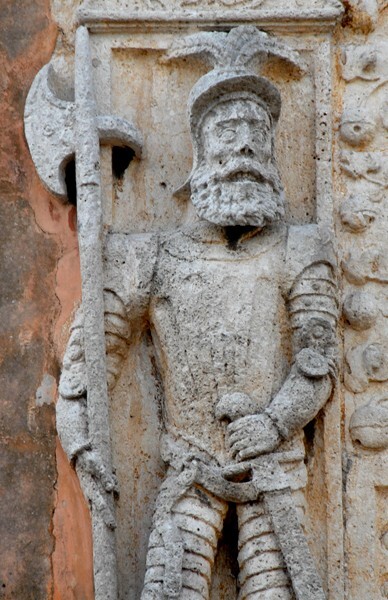 Casa de Montejo, façade, second story, left halberdier - Casa de Montejo
