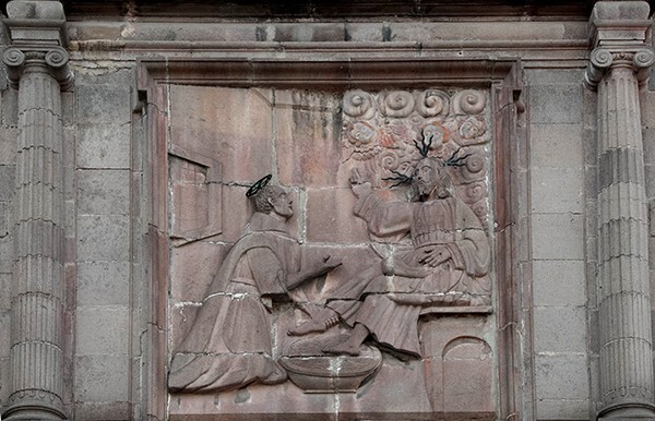 Façade, central relief, St. John of God washing Christ's feet - San Juan de Dios