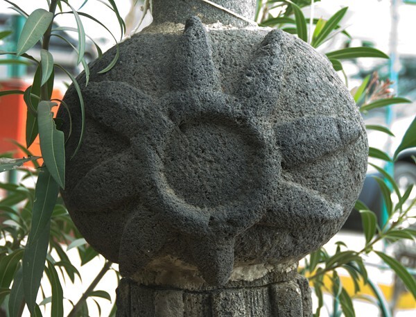 Atrial cross finial, sun - San Martín, façade, posa chapel & atrial cross