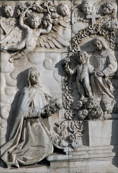 Façade, left portal relief, St. Rose of Lima before Lady of the Rosary - Catedral de la Inmaculada Concepción