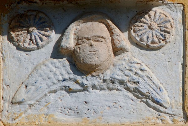 San Antonio de Padua, façade, choir loft window relief, cherub - Hopelchén, Campeche