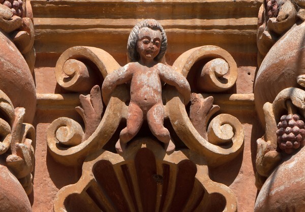 Intercolumniation, cherub - Façade, lateral portal & sacristy door