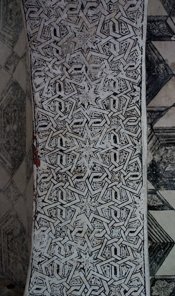 Lower cloister walk arch, arabesque mural - San Guillermo