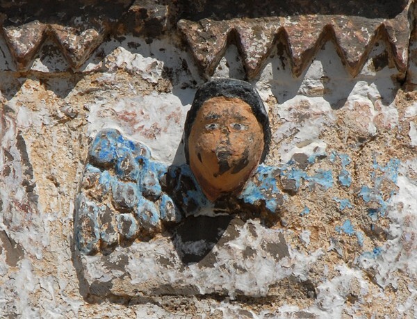 Santo Tomás, façade portal alfiz, left seraph - Santo Tomás, Michoacán