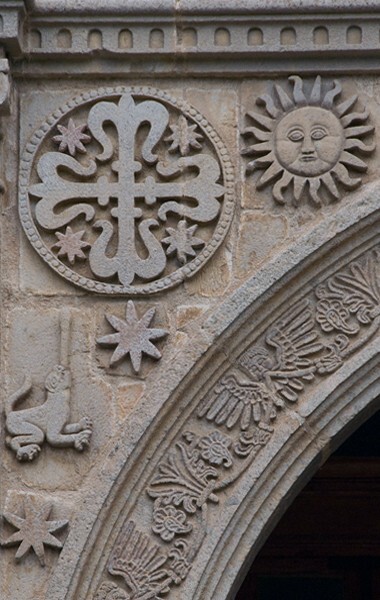 Façade portal, left spandrel - Façade, nave & sanctuary