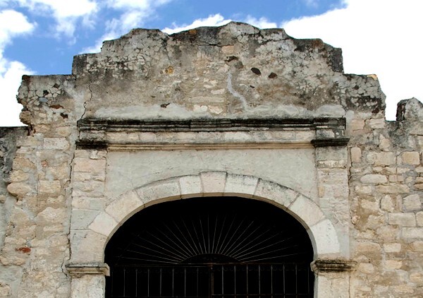 NW posa chapel, alfiz - Façade, exterior buttressing, lateral portal, open & posa chapels, atrio & cross