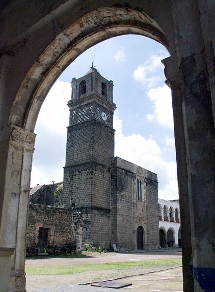 San Andrés, façade seen from NE posa - San Andrés, façade, portería & atrial gate