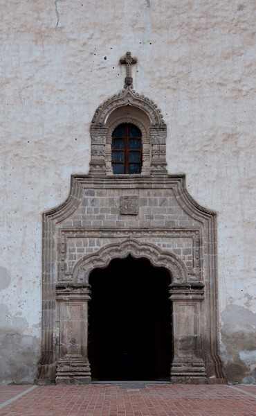 Façade, main portal & choir loft window alfiz - La Asunción de Nuestra Señora, façade, porciúncula portal, capilla abierta, nave & cloister