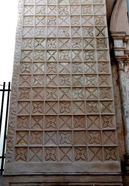 San Agustín, façade, left bell-tower base - San Agustín