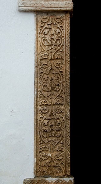 Façade portal, left pilaster - El Señor de la Salud