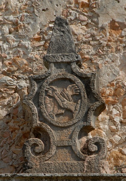 San Antonio, façade portal, cornice finial (left) Franciscan insignia - Ticum, Yucatán