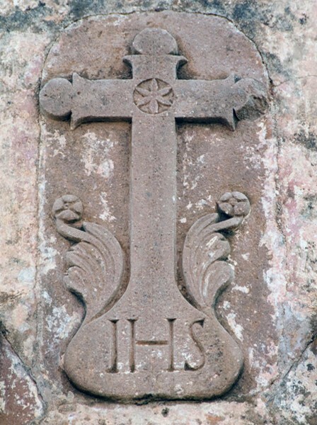 Façade cross with Christogram - El Humilladero