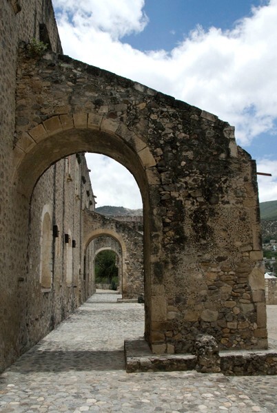 East wall buttressing - Façade, exterior buttressing, lateral portal, open & posa chapels, atrio & cross