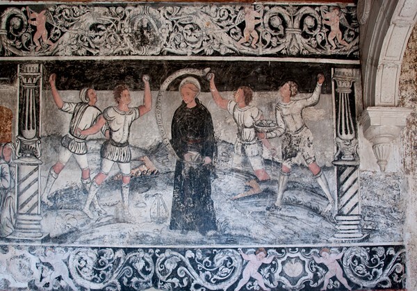 S wall, friar being stoned - San Miguel Arcángel, cloister with murals