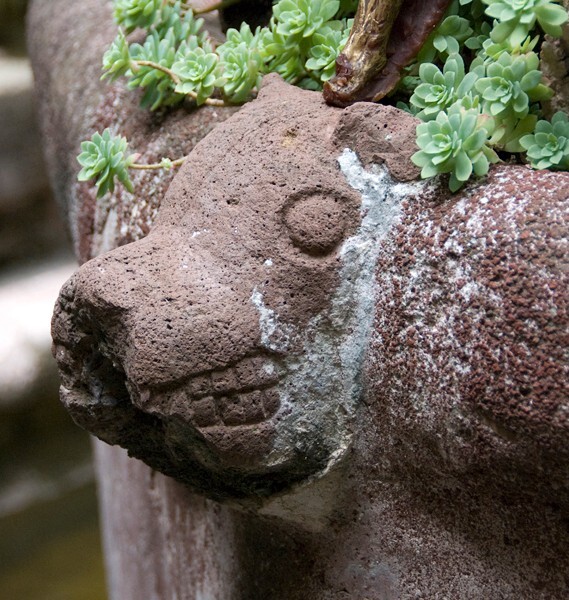 Cloister fountain, basin relief - San Juan Bautista, cloister & murals