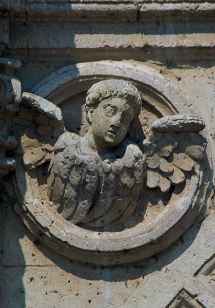 Façade portal, left spandrel roundel, seraph - San Pablo, façade, portería & convento