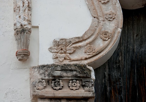 San Miguel, façade portal, mixtilinear arch & left pilaster impost - San Miguel Huautla, Oaxaca