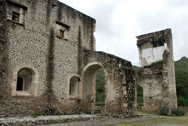 East exterior nave, flying buttress - Façade, exterior buttressing, lateral portal, open & posa chapels, atrio & cross