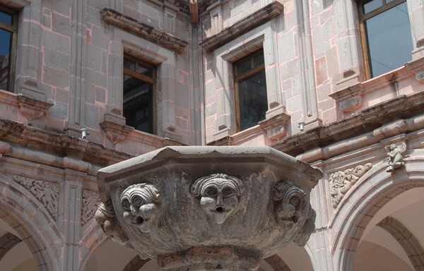 Cloister fountain wellspout & upper story windows - Santiago