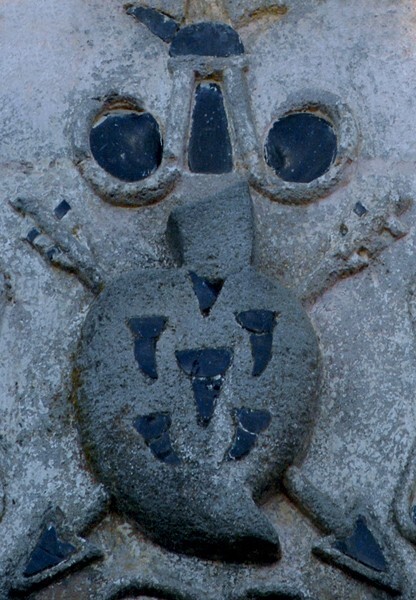 Façade, central relief detail, Augustinian insignia - San Agustín