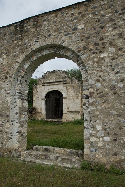 NW posa chapel - Façade, exterior buttressing, lateral portal, open & posa chapels, atrio & cross