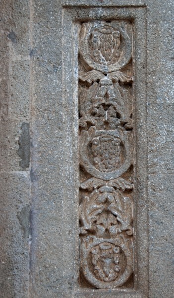Façade portal, left pilaster relief - San Andrés, façade, portería & atrial gate