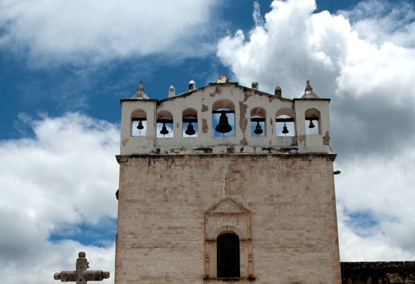 Façade espadaña - Façade, exterior buttressing, lateral portal, open & posa chapels, atrio & cross