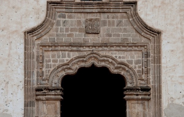 Façade, main portal alfiz - La Asunción de Nuestra Señora, façade, porciúncula portal, capilla abierta, nave & cloister