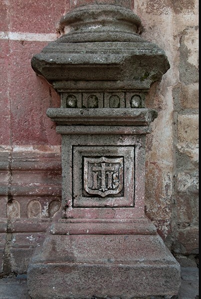 Façade column base (right) - San Miguel Arcángel, façade, portería, crosses & porciúncula door