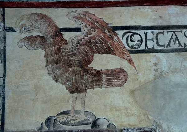 Lower cloister walk, portal mural, eagle - San Juan Bautista, cloister & murals