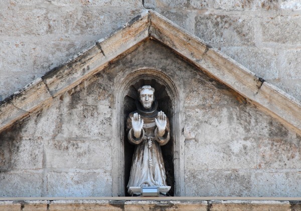 Façade, main portal, pediment sculpture, St. Francis - La Mejorada