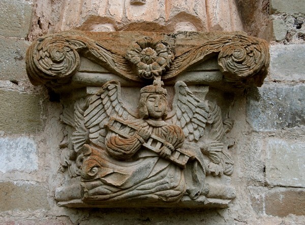SS Pedro & Pablo, façade, sculpture niche base relief, Passion angel - San Pedro y San Pablo