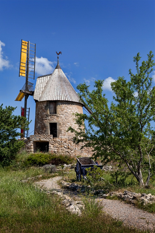 Image of windmill under blue sky