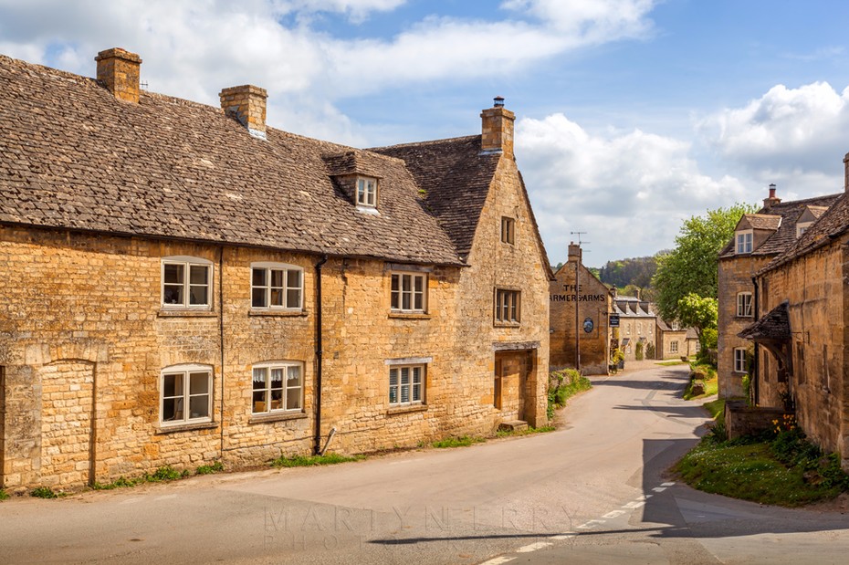 Guiting power high street in the warm sunshine