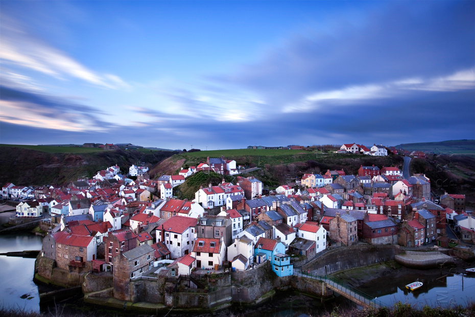 Long exposure photograph of Staithes village at sunrise
