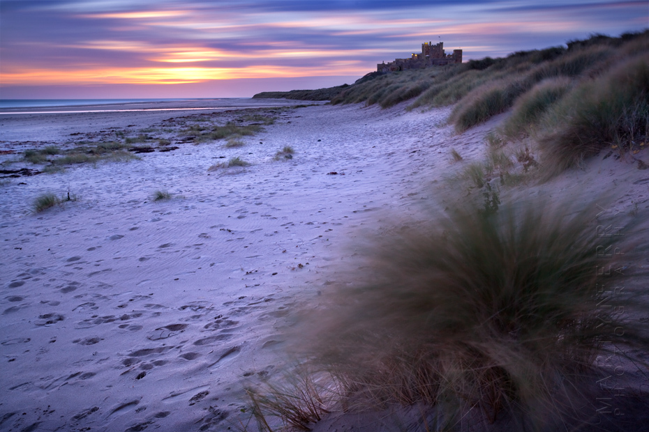 Sunrise colours over Bamburgh Castle in Northumberland