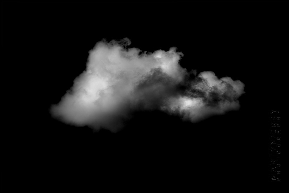 Fine art photography of clouds floating in black nothingness