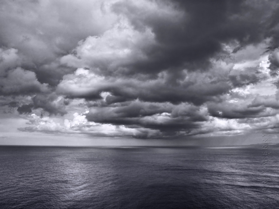Striking clouds hover over the ocean