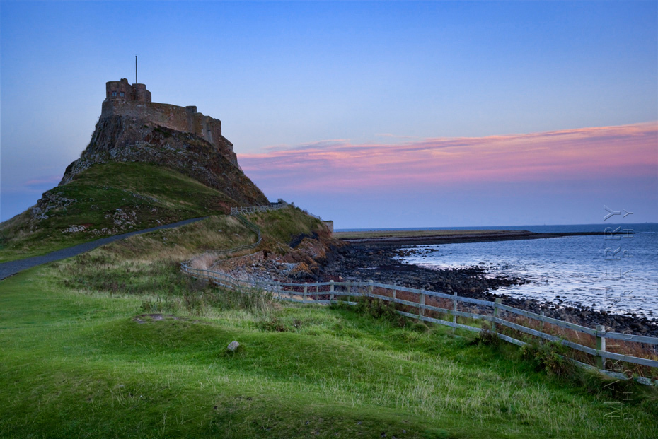 Sunset colour over Lindisfarne Castle in Northumberland