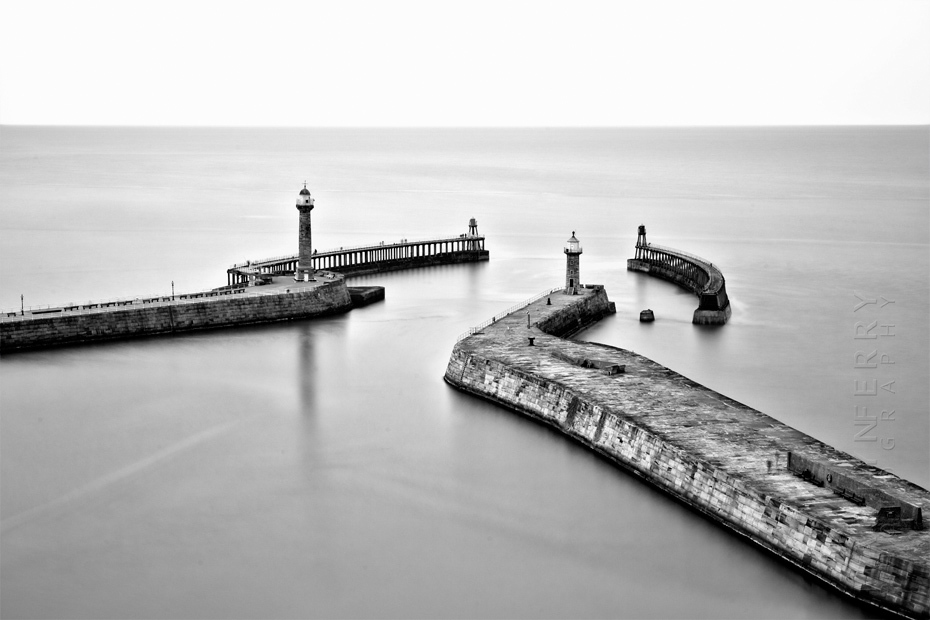 Whitby piers in stunning black and white