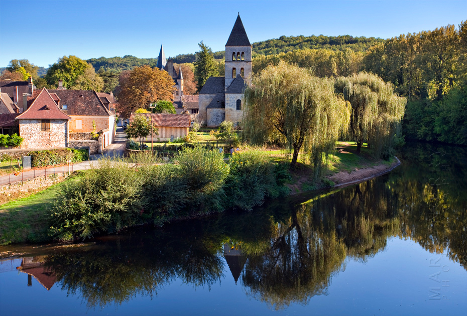Photograph of warm sunlight on the church at St Leon sur Vezere