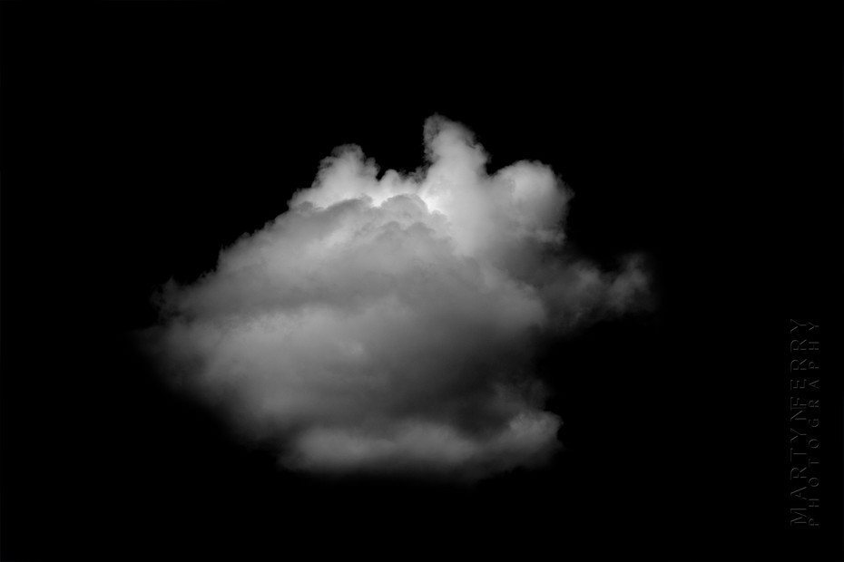 Fine art photography of clouds floating in black nothingness