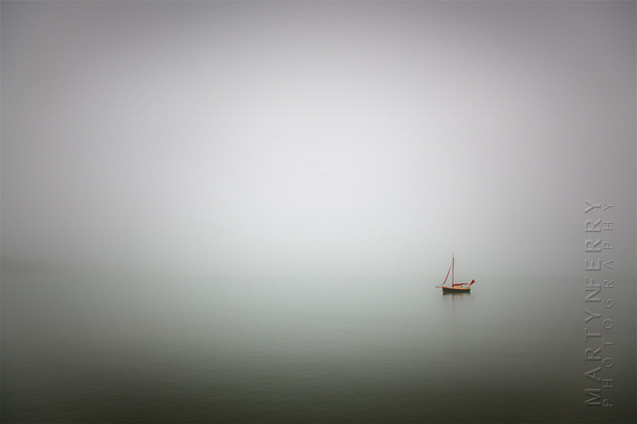 Striking minimal photograph of solitary boat at sea in Dorset