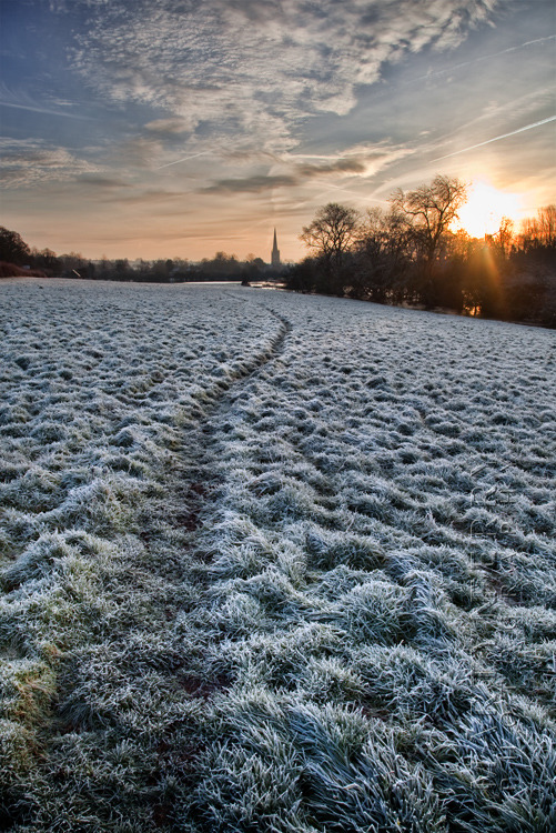 Winter image of a frosty path heading towards Burford at sunrise