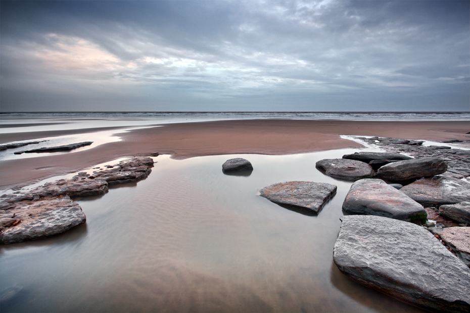 Seascape photograph at Dunraven Beach and stormy skies