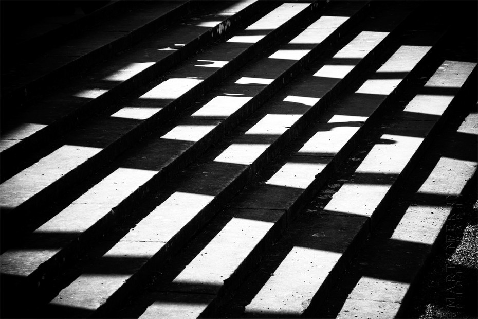 Sunlight casts shadows on steps