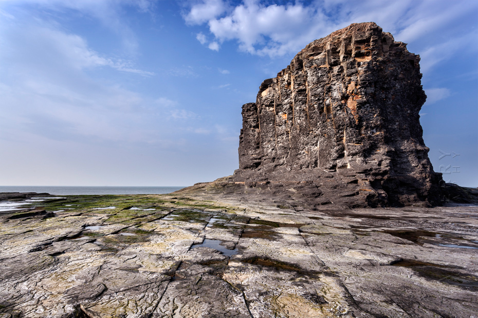 Impressive rock stack at Saltwick Bay on a sunny afternoon