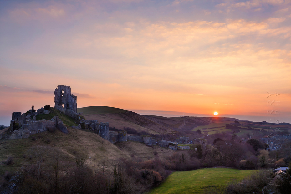 Iconic ruins of Corfe Castle in Dorset at sunrise