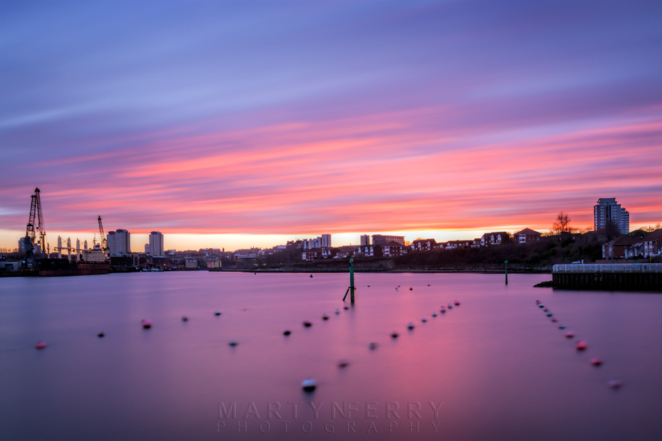 Sunset clouds move over the harbour and city of Sunderland